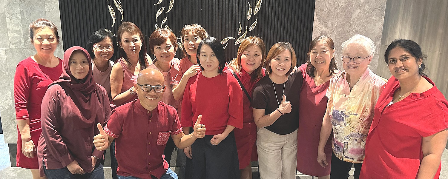 Daniel Tan with the stay-at-home mothers he hires and trains at Food Playground
